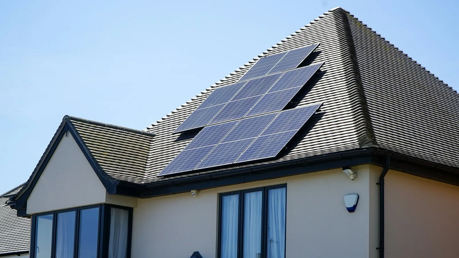 A house with solar panels set into its tiled roof